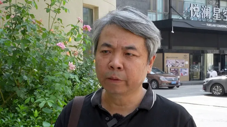 Li Eryou, dont le fils se trouvait à bord de l'avion disparu en 2014.